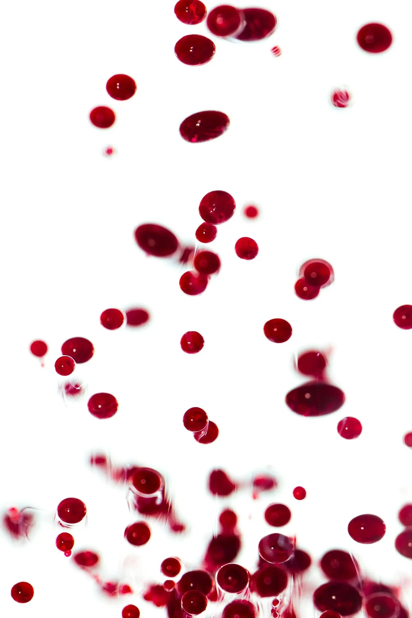 Abstract burgundy pebbles encased in wax.